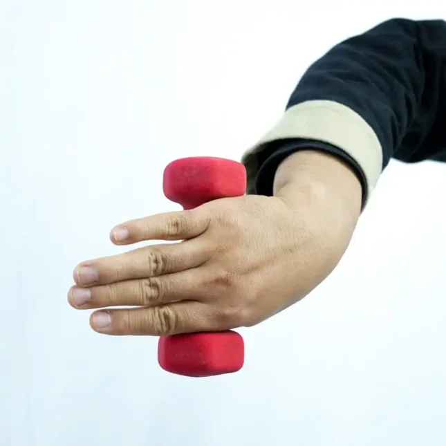 Wing Chun dumbbell in use during training for strength and endurance exercises.