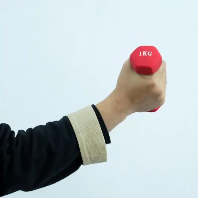 Wing Chun dumbbell in use during martial arts strength training.